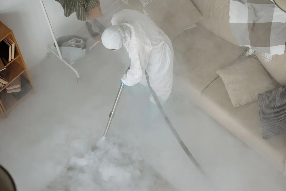 Biohazard cleanup technician in protective equipment, Englewood, TN